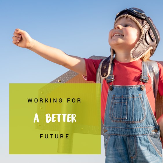 A little boy smiling with text reading &#039;working for a better future&#039;