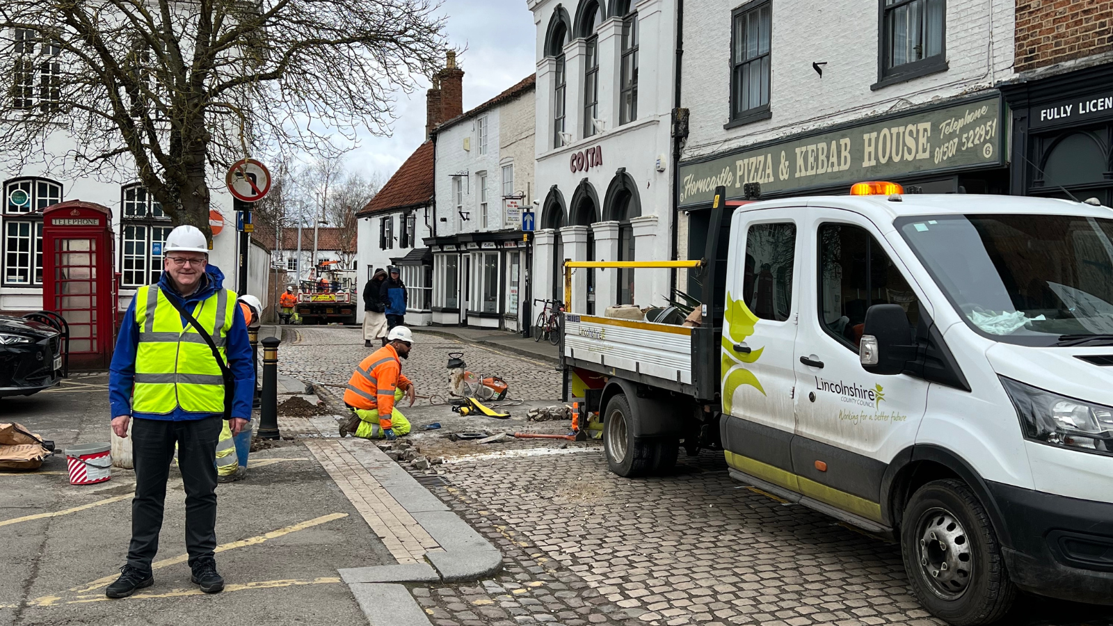 Cllr William Gray, local councillor for Horncastle, and the LCC Highways team at work in the town on Sunday