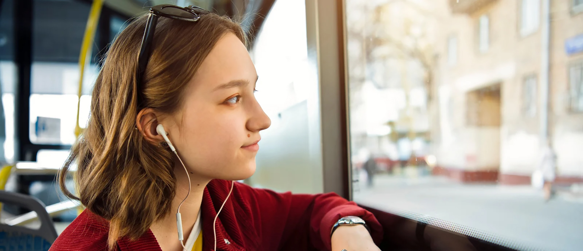 Image of a young adult looking out the window