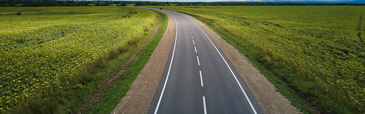 Image of a road with fields either side