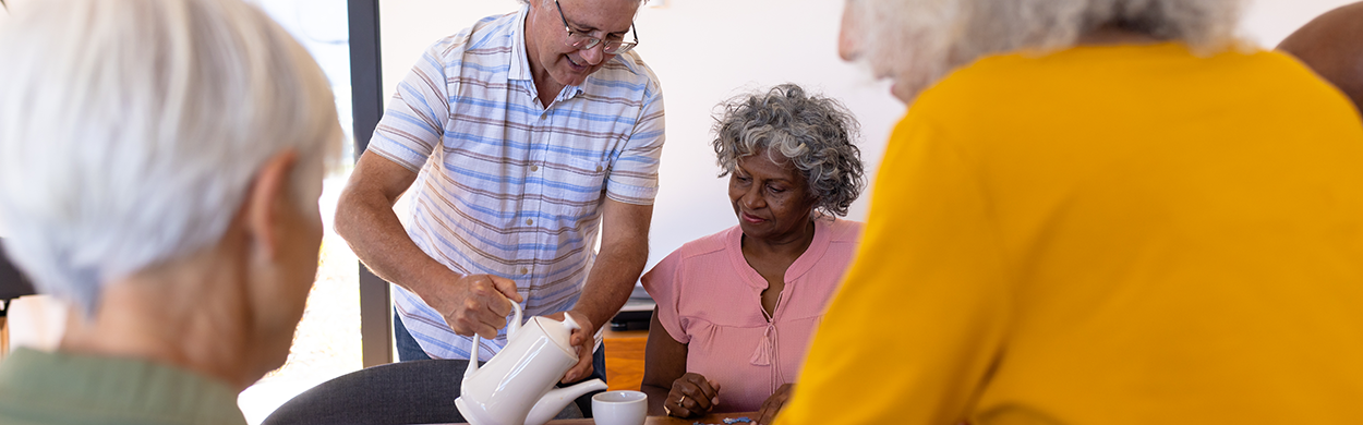 Image of a senior man serving coffee