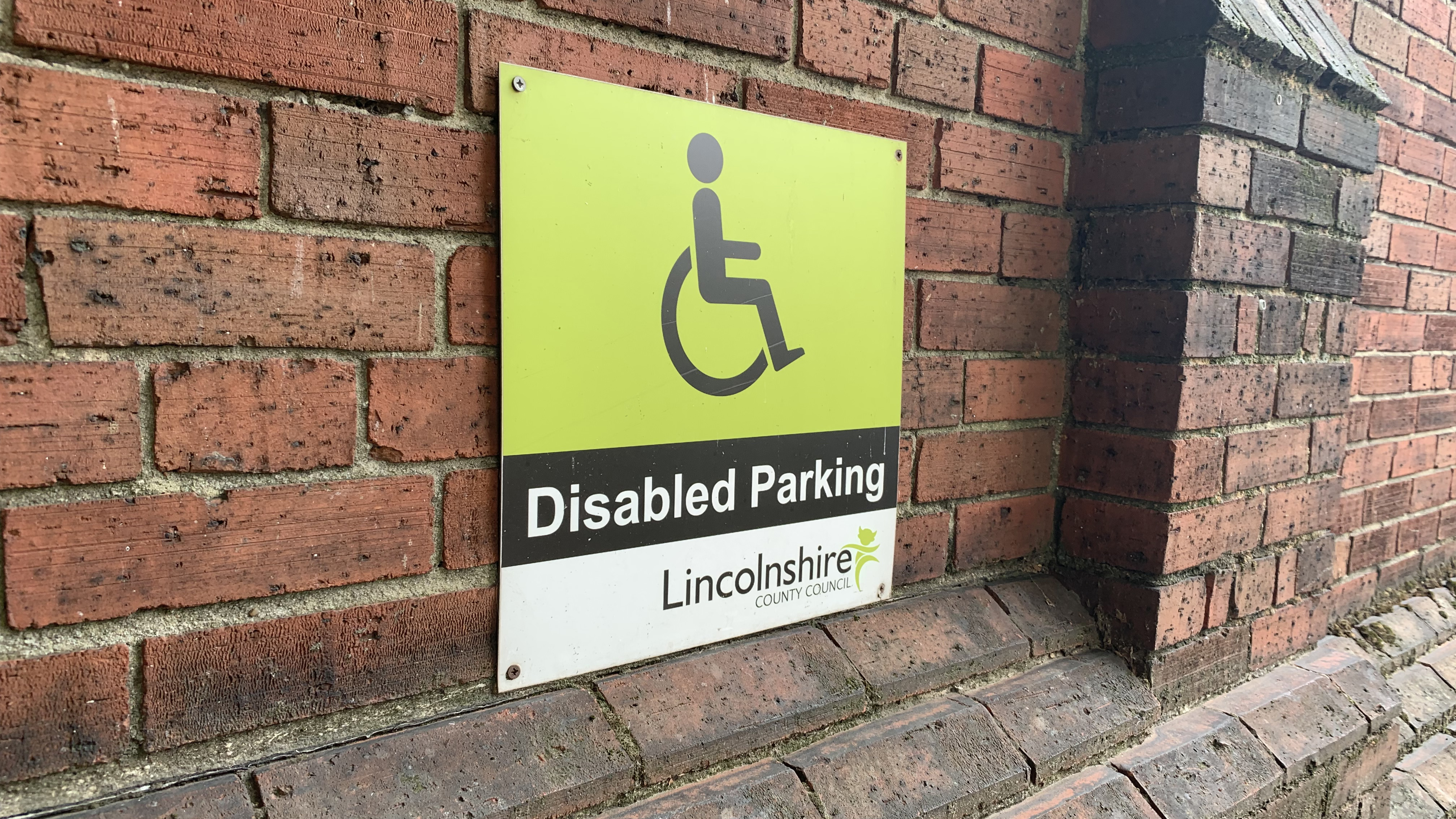 Disabled parking bay sign at the council.