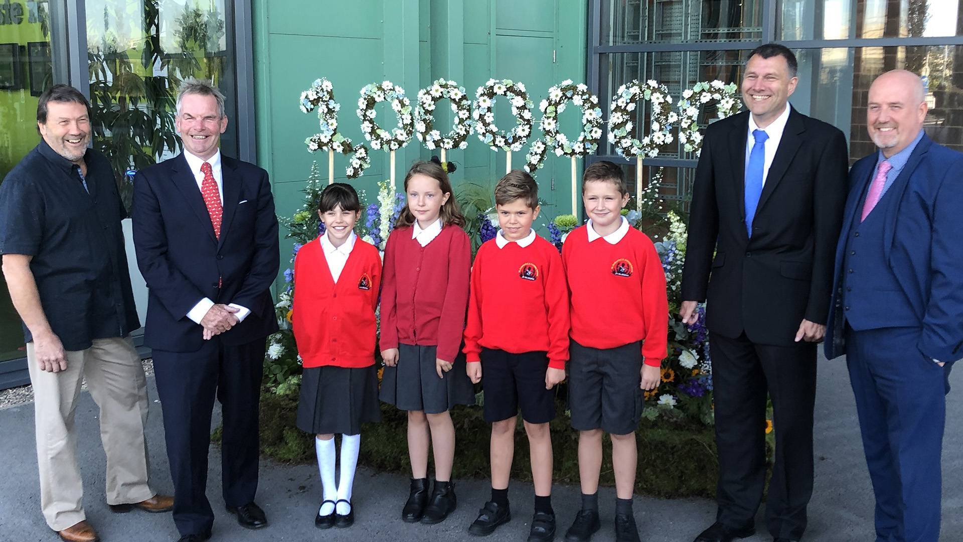 Executive member for Waste and Resources Cllr Eddy Poll, Leader of the Council Cllr Martin Hill, children from St Andrew's Primary School and Juergen Schaper, facility manager at FCC Environment.