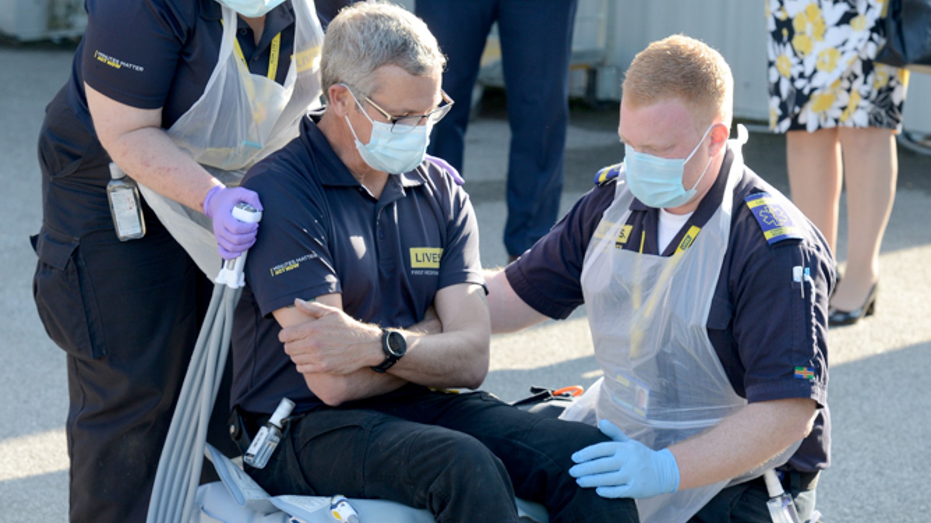 Image of the Falls Response Service launch with LIVES staff showing how some equipment is used to help those who have fallen.