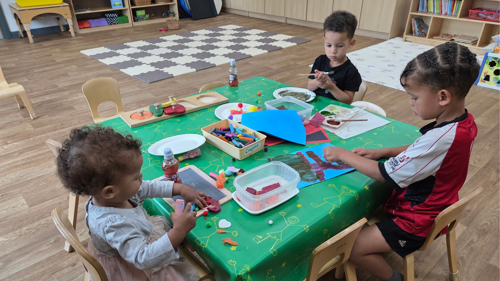 Three children playing in a family hub