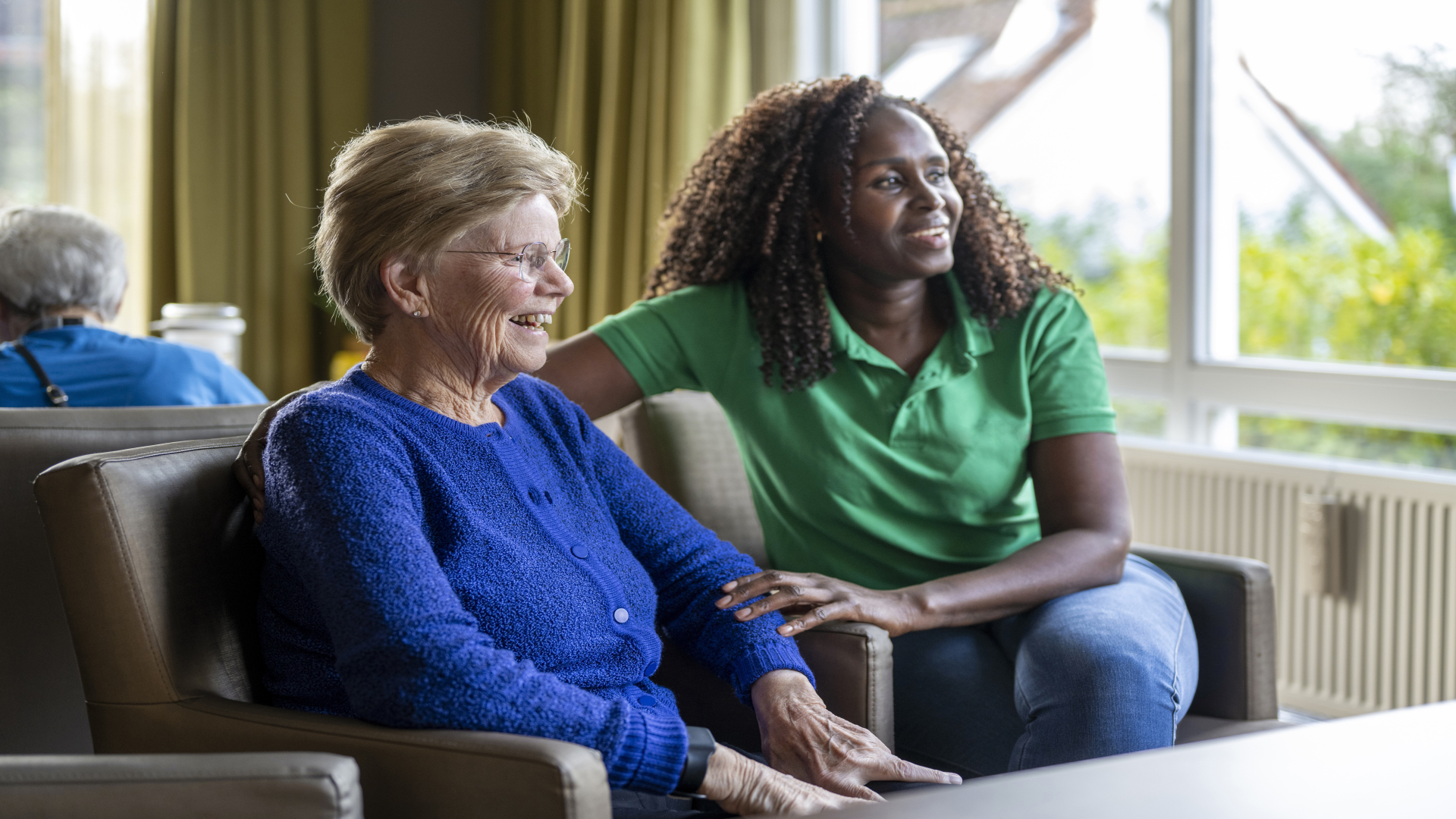 Helper caring for elderly lady