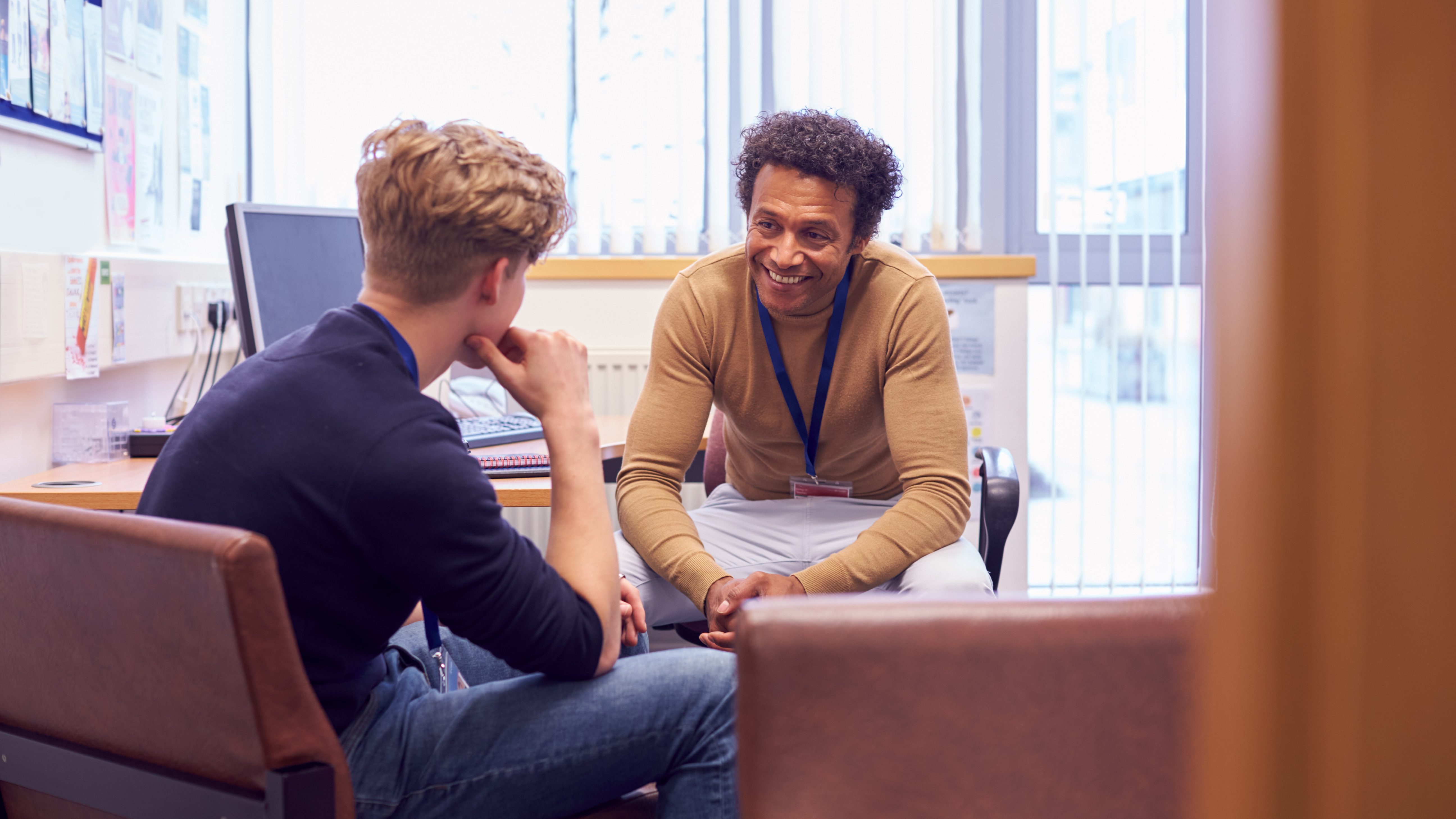 Image of two people talking