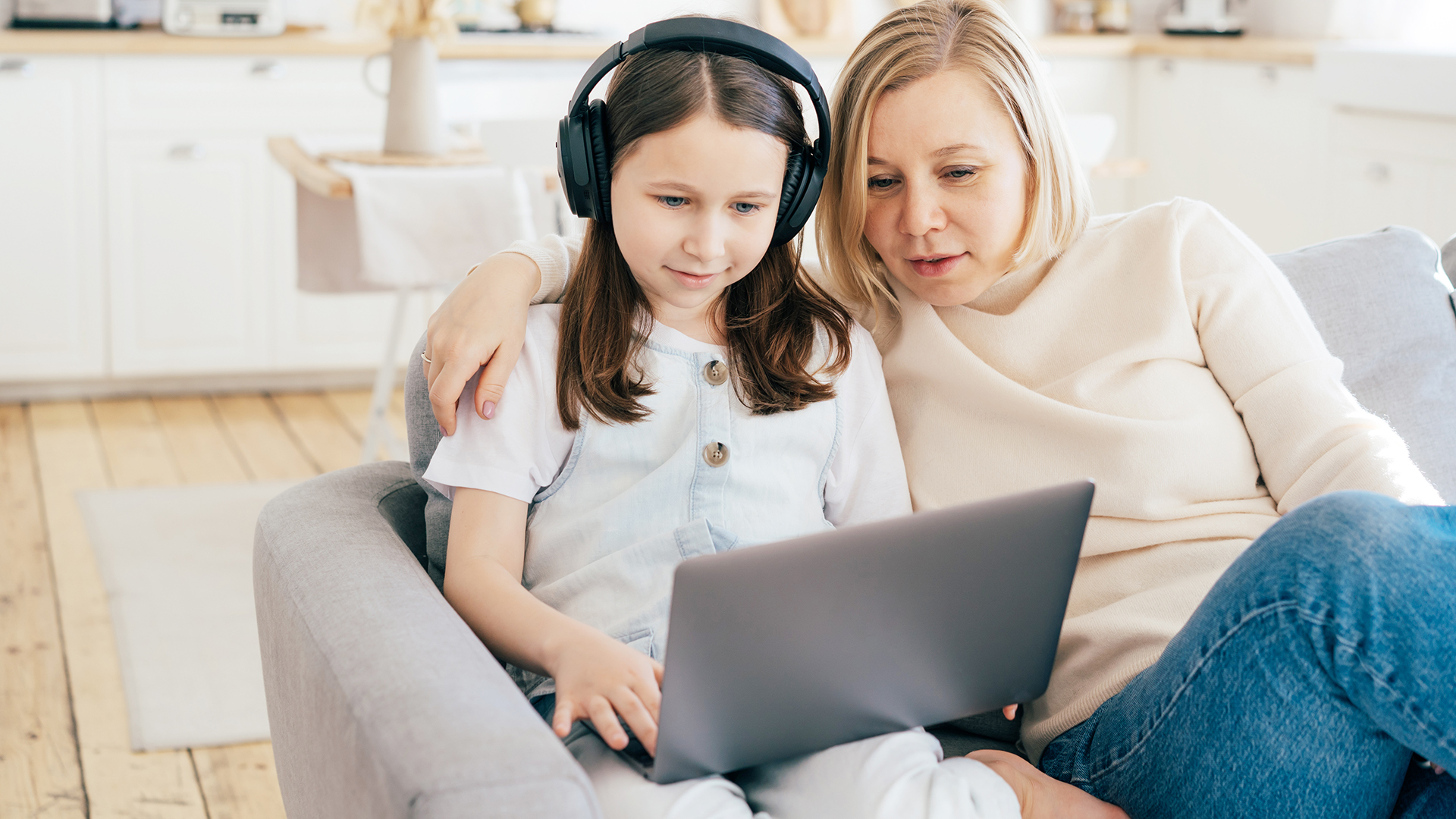 Image of a mother and daughter on a laptop