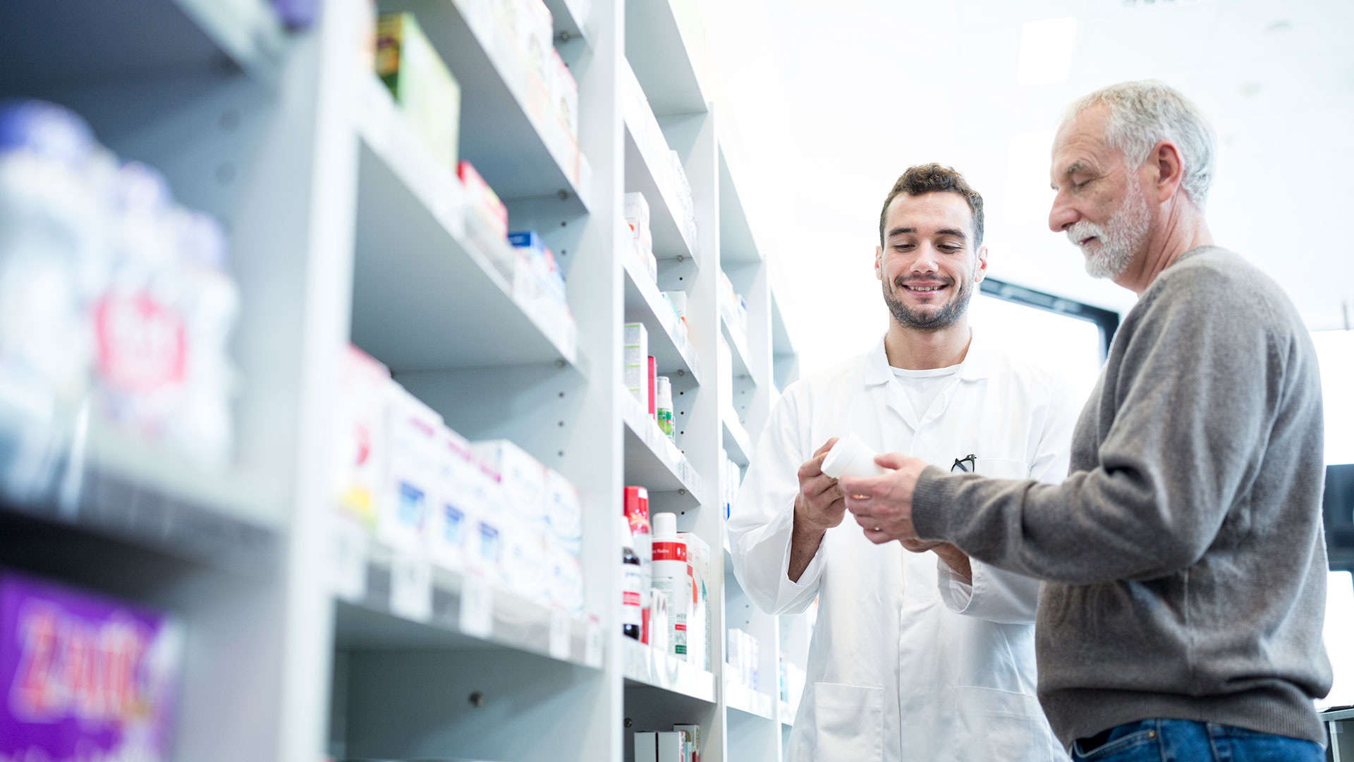 Pharmacist advising customer