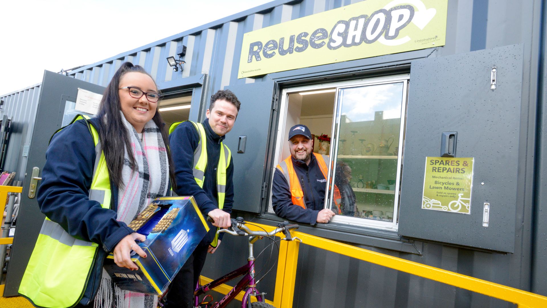 Staff in front of the Reuse shop