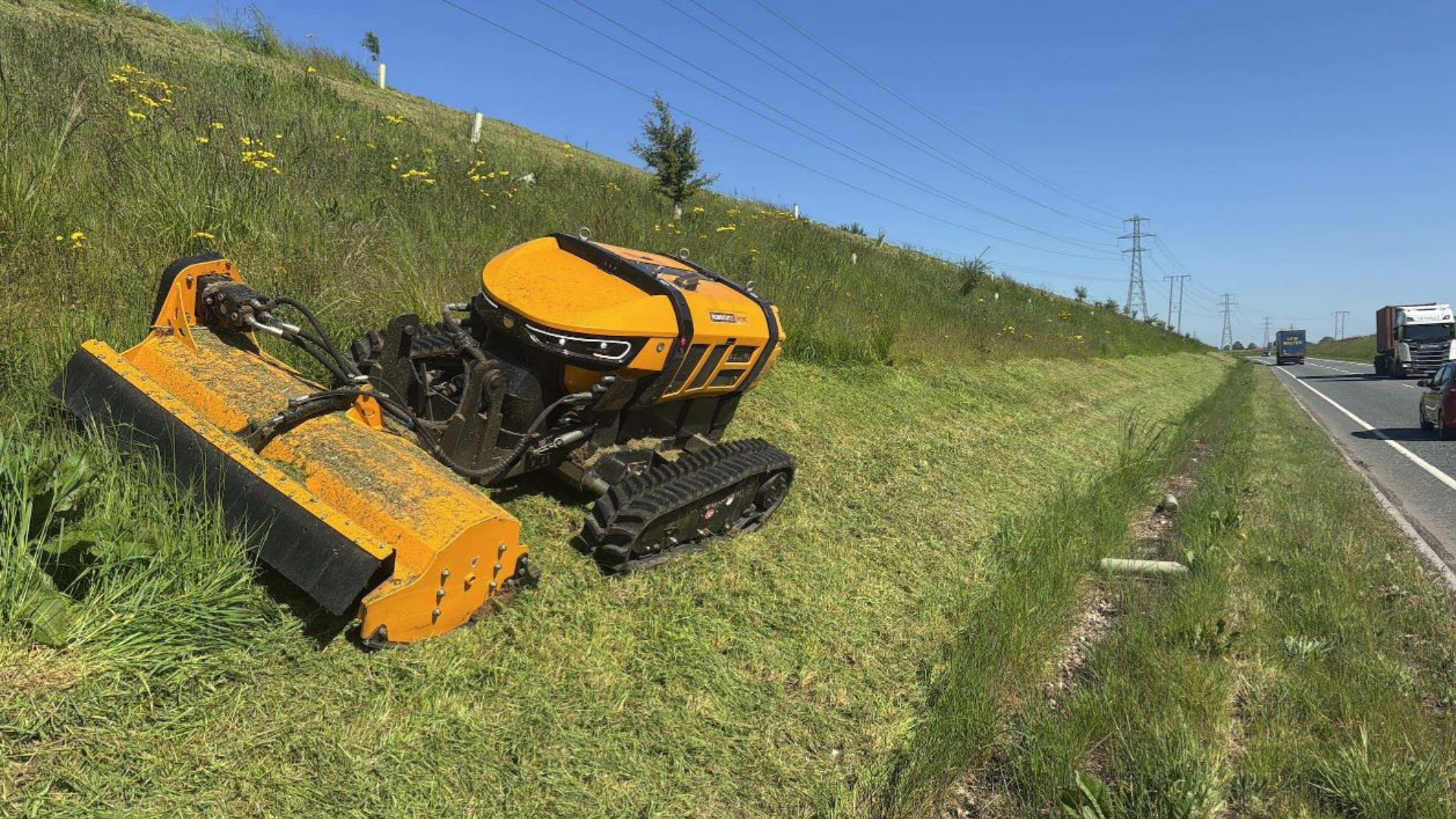 A robot mower cuts the verge