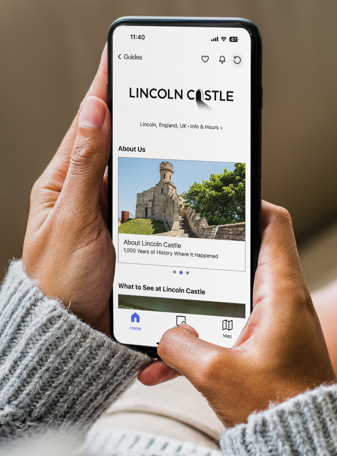 Photo shows a person looking at Lincoln Castle's Bloomberg Connects profile on a mobile phone