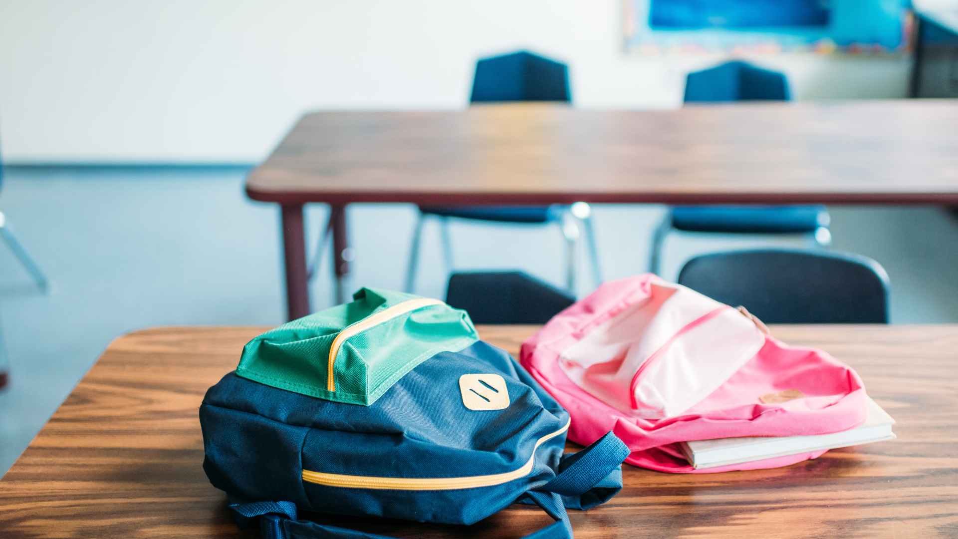 School classroom with backpacks on desks